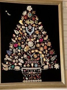 an embroidered christmas tree is hanging on the wall