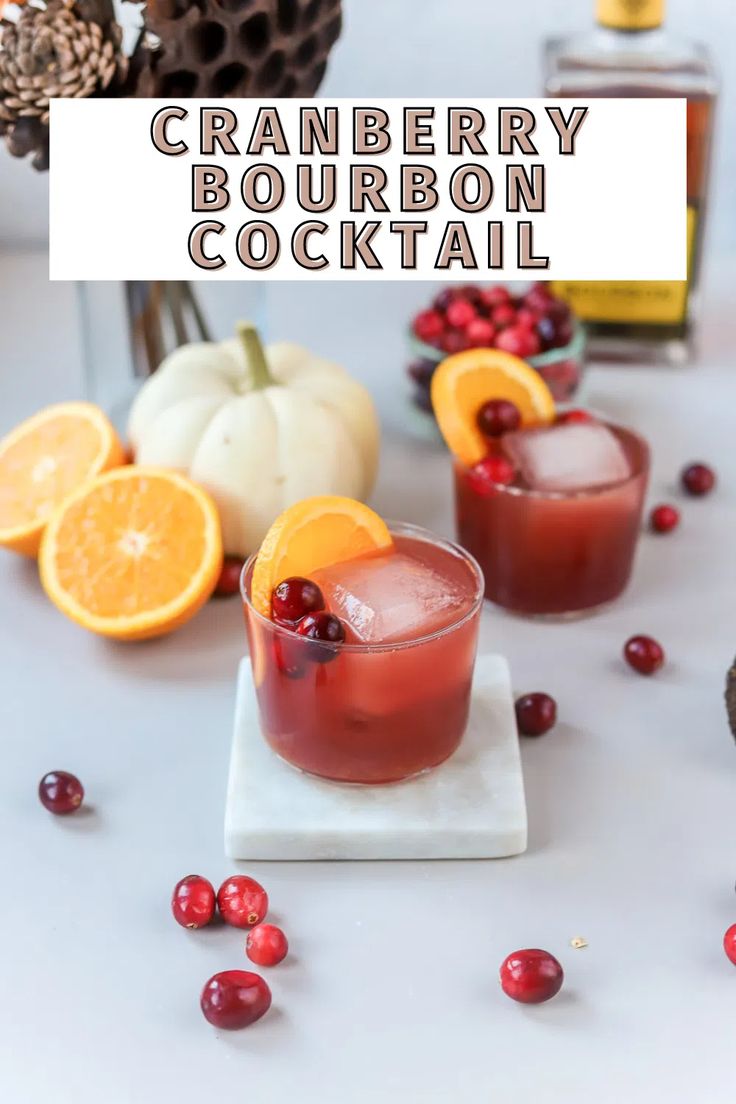 cranberry bourbon cocktail with orange slices and cranberries