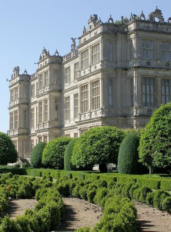 a large building with lots of trees in front of it