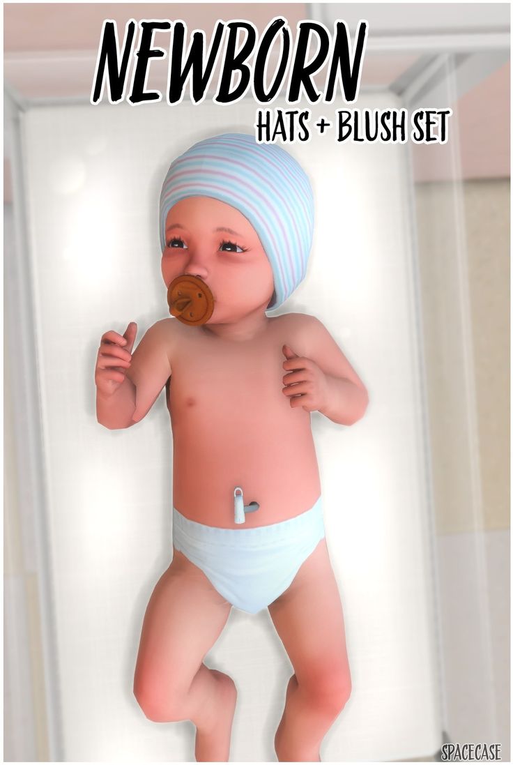 a baby wearing a blue hat and diaper with a button in it's mouth