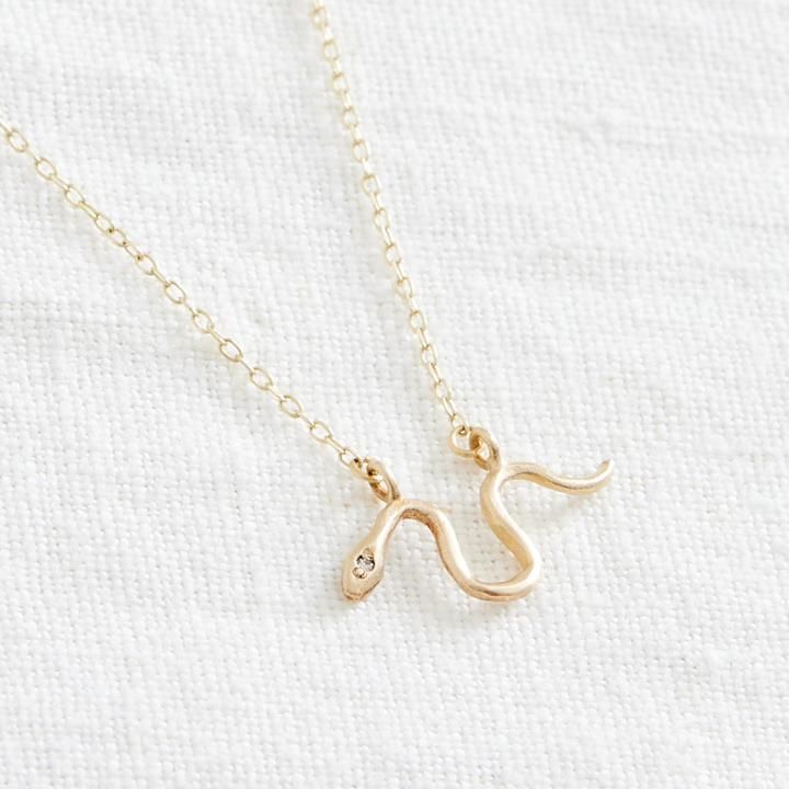 Wilds Necklace – Marisa Mason Symbolic 14k Gold Charm Necklace With Adjustable Chain, Dainty Charm Necklaces With Curb Chain For Gifts, Symbolic Snake Shaped Necklace For Gift, Symbolic Snake-shaped Necklace For Gift, Dainty 14k Gold Charm Necklace With Box Chain, Symbolic Snake Necklace As A Gift, Minimalist Gold Snake Necklace, Everyday Snake Shape Box Chain Jewelry, Gold Snake-shaped 14k Gold Necklace