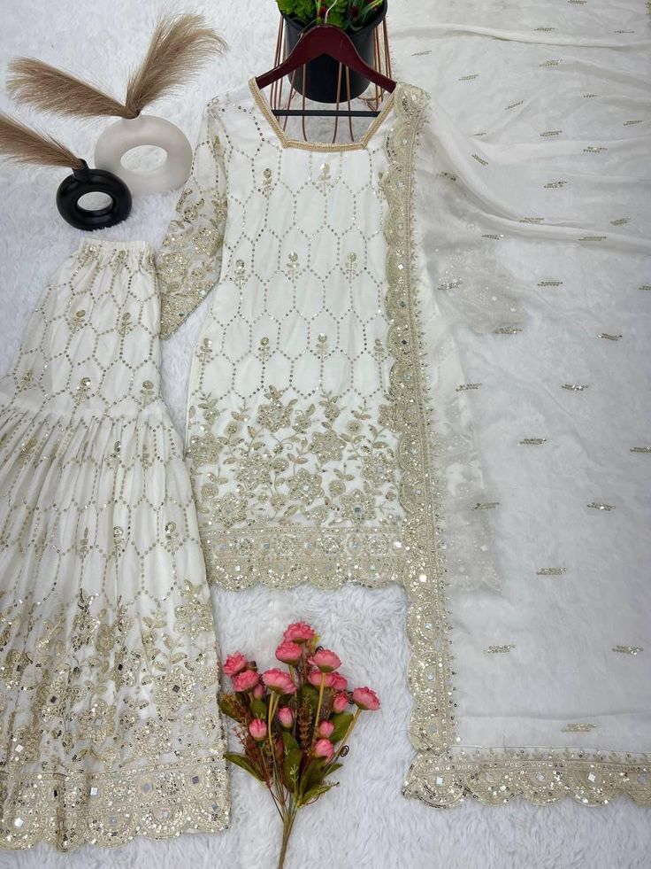 Top Fabric Chinnon Silk With Heavy Embroidery Sequence and Mirror pasted Top Length 36-37 " Sharara Chinnon Silk With Embroidery sequins and mirror pasted Dupatta  Chinnon Silk With Embroidery Sequence Work With Real Mirror Hand Work And Four Side Lace Border White Sequin Sets For Eid, White Embellished Embroidered Fabric For Celebrations, White Sequined Sharara For Festive Occasions, Festive White Sequined Sharara, White Sharara With Sequins For Eid, White Sequined Sharara For Eid, White Embellished Semi-stitched Sharara, White Sequined Sharara For Reception, Party Embroidered Chinon Fabric With Sequins