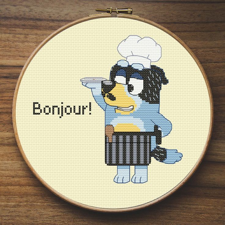 a cross stitch pattern with a dog in a chef's outfit and the words bonjou on it