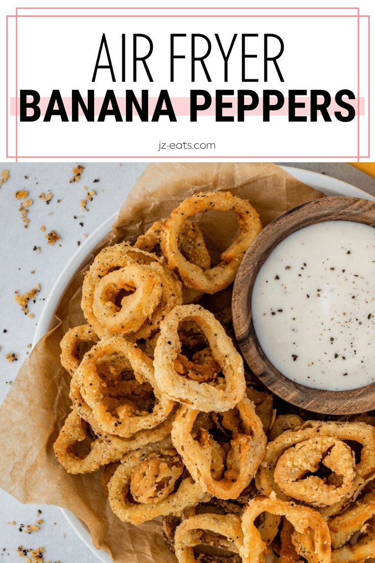 air fryer banana peppers on a white plate with a small bowl of ranch dressing