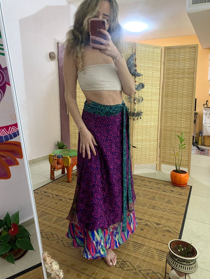 This unique wrap skirt is a one of a kind in the hole world ✨ The fabric goes on it's one unique story as it is a  one of a kind recycled vintage silk hand picked from unique places and villages 🌱 The fabric also  is so soft and silky and has so many small details that make just that much more Beautiful  ⚛️ It's a 2 in 1 skirt ! As you can where it in its 2 defrent sides✨ Skirt is great for every day, And also luxurious and Stunning for evening where. 🌞 Fabric is is the best thing about it, An Traditional Long Wrap Skirt For Beach, Flowy Lined Wrap Skirt, Traditional Flowy Wrap Skirt For Festival, Bohemian Wrap Skirt For The Beach, Bohemian Wrap Skirt For Summer, Bohemian Harem Skirt For Festivals, Bohemian Pleated Skirt, Long Bohemian Skirt For Festivals, Bohemian Purple Tiered Skirt