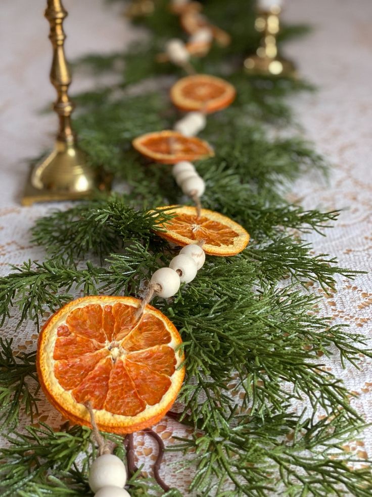 an orange slice is cut in half and placed on a table with other fruit pieces