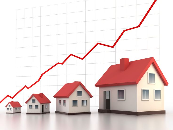 a line graph with houses in front of it and a red arrow going up to the top