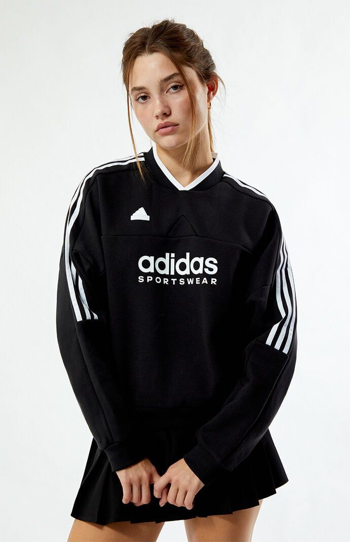 Stay cozy and stylish in the Tiro Fleece Sweatshirt from adidas. Featuring a flattering V-neckline and long sleeves with dropped shoulders, this sweatshirt offers a relaxed fit for all-day comfort. The iconic 3-Stripes down the sleeves and adidas logo graphic add a sporty touch, while the adidas rubber brand label ensures authenticity.Solid color sweatshirtV-necklineLong sleevesDropped shouldersadidas graphic and rubber brand labelRibbed trimming70% cotton, 30% recycled polyesterMachine washableModel is wearing a size smallModel measurements: 5’6.5” height, 32” bust, 23.5” waist, 35” hipLearn more about PacSun eco items adidas Womens Tiro Fleece Sweatshirt - Black size Small Black Clothes For Women, Adidas Black Sweatshirt For Sports, Black Adidas Crew Neck Sweatshirt, Sporty Black Adidas Sweatshirt, Black Adidas Sweatshirt Sportswear, Black Long Sleeve Adidas Logo Sweatshirt, Adidas Sweatshirt, Adidas Sportswear, Chill Fits