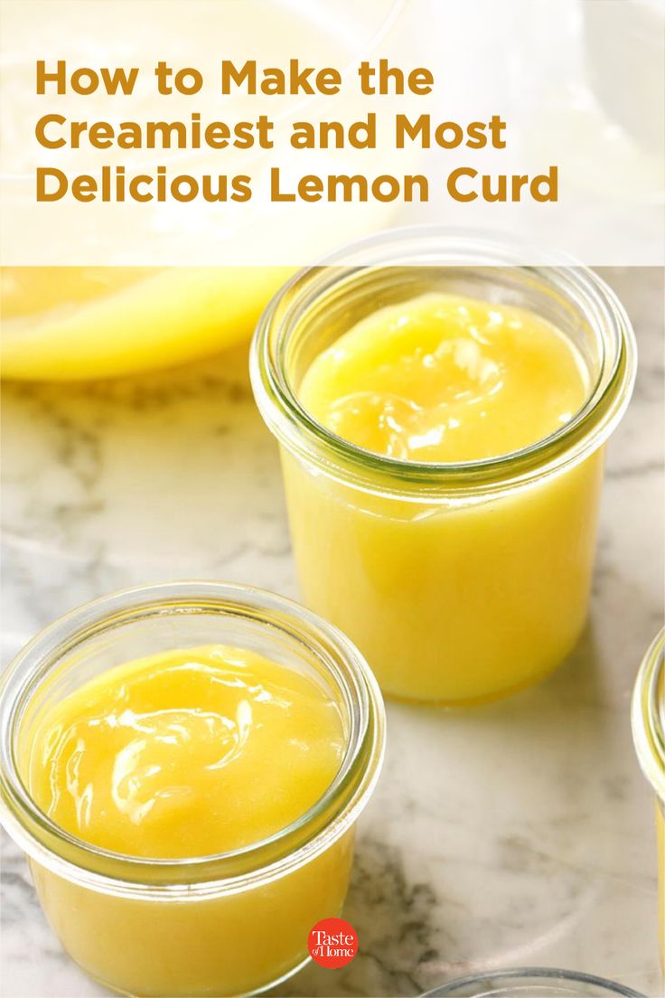 three jars filled with lemon curd sitting on top of a counter