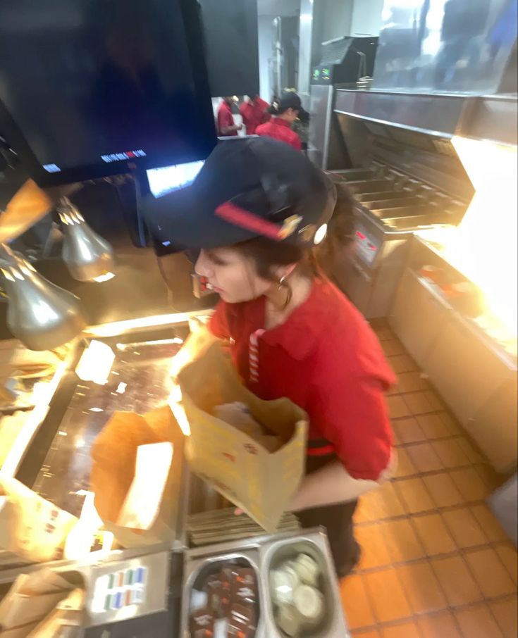 a person sitting at a counter with some food