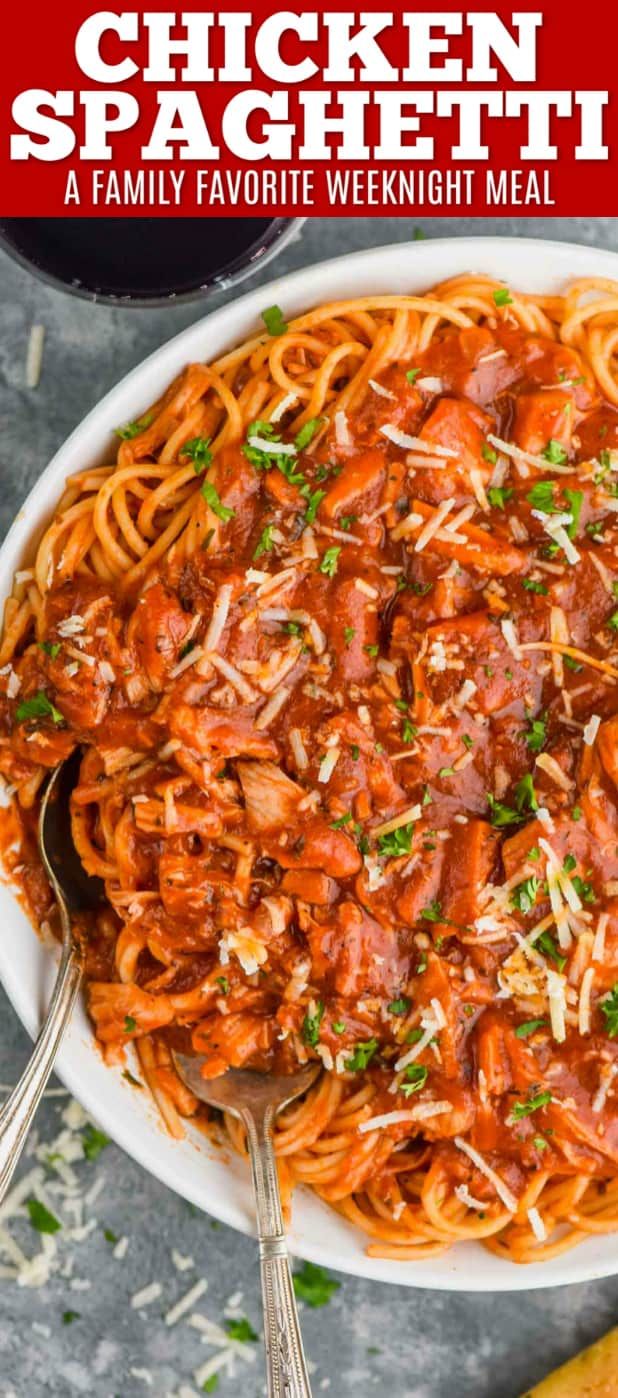 chicken spaghetti with tomato sauce and parmesan cheese in a white bowl