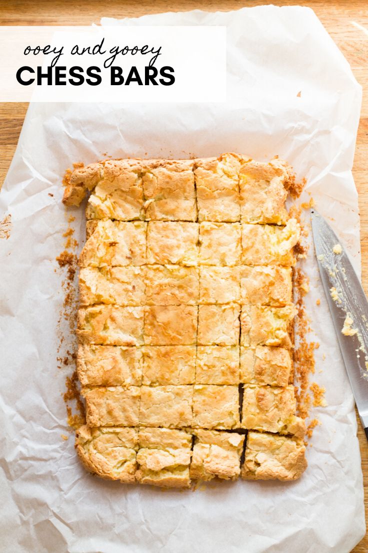 a close up of a pie on a piece of paper next to a knife and fork