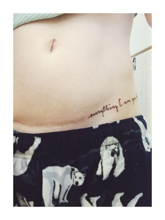 a woman's stomach with the words everything i want is love written on it