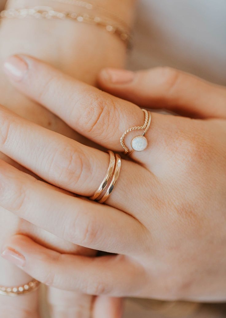 Originally designed to be paired with one of our Gemstone Rings, our Dune Ring stacks beautifully with any Stacking Bands and can hold it's own as a solo ring, too. Twisted wire is hand-shaped and made into a unique stacking ring. Available in 14kt Gold Fill + Sterling Silver. Handmade in Eau Claire, WI. Our jewelry is handmade so each piece will be unique and may vary slightly from what is pictured. Adjustable 14k Gold Minimalist Bypass Ring, Dainty Adjustable Stackable Toe Rings, Adjustable Double Band Fine Jewelry, Minimalist Stackable Adjustable Midi Rings, Minimalist Adjustable Stackable Midi Rings, Adjustable Stackable Minimalist Midi Rings, Adjustable Solitaire Rings For Everyday, Minimalist Adjustable 14k Gold Bypass Ring, Dainty Stackable Open Ring Jewelry