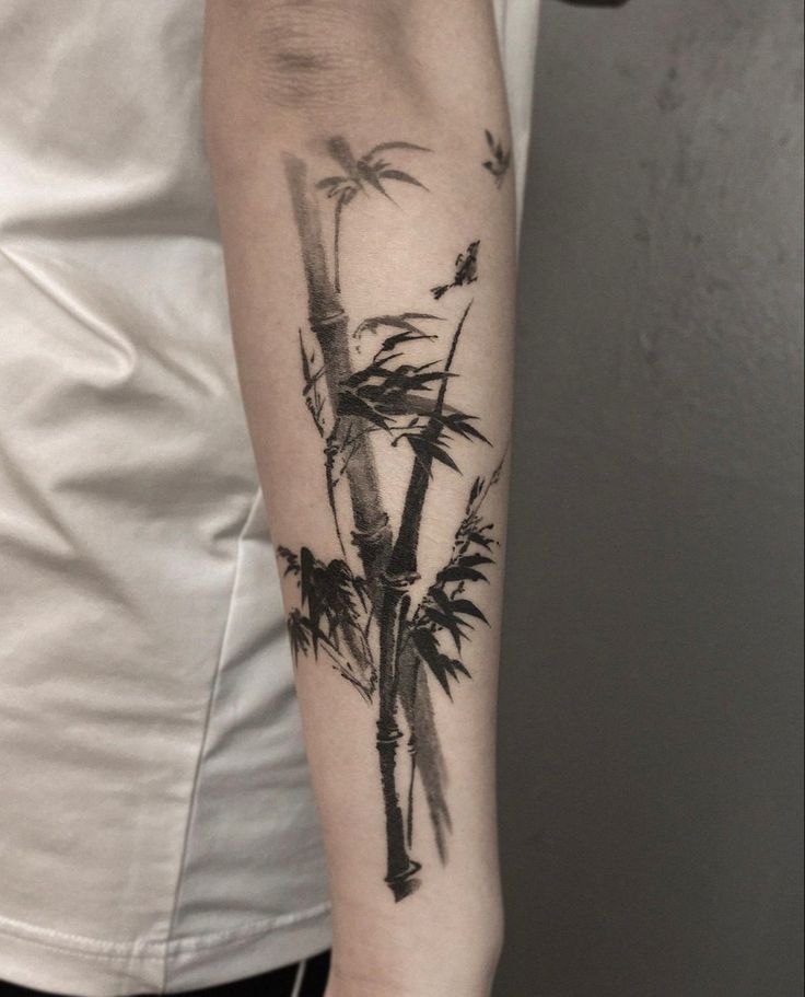 a person with a palm tree tattoo on their arm