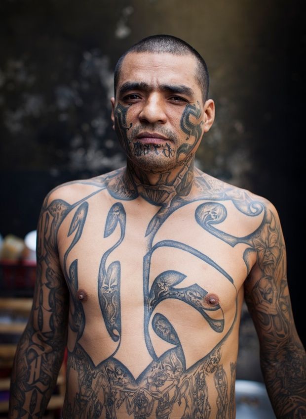 a man with tattoos on his body and chest