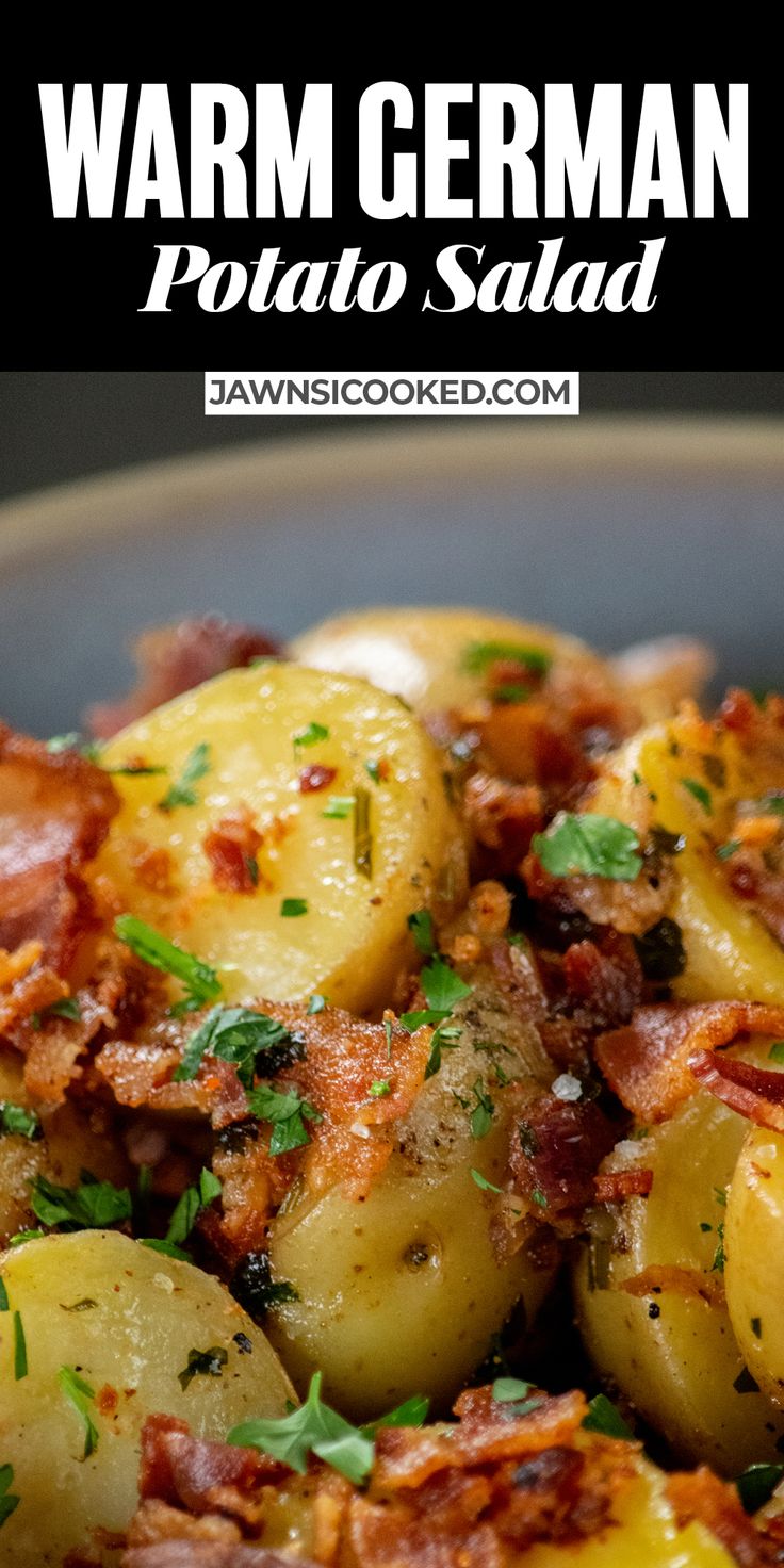 a close up of potatoes with bacon and parsley on the side in a bowl