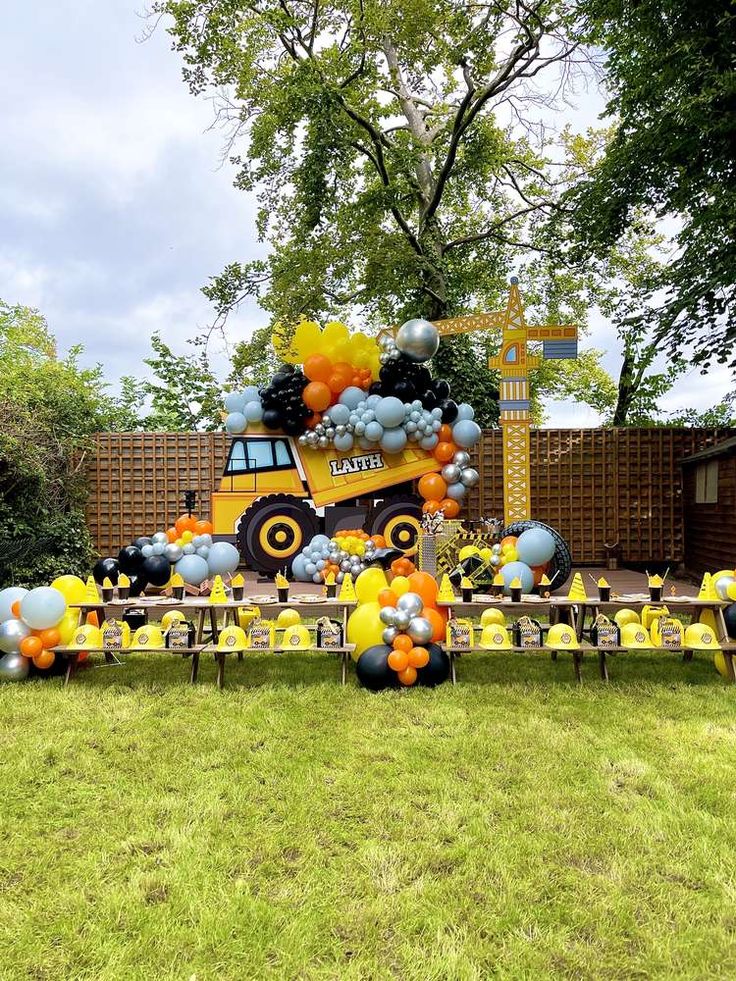 a construction truck themed birthday party with balloons