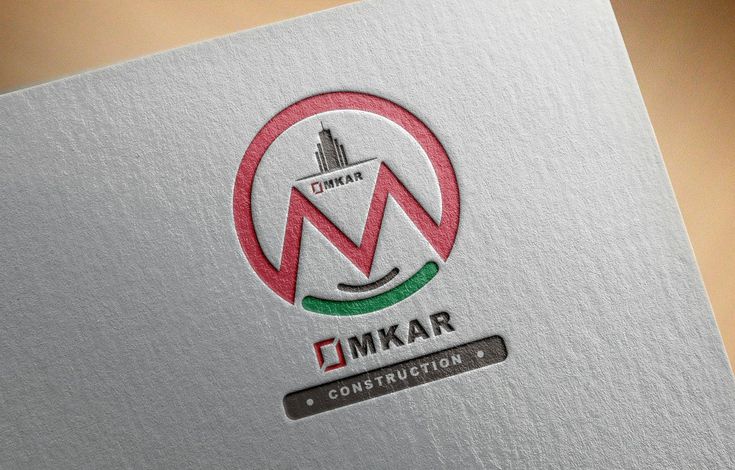 the logo for kmkar construction is displayed on a piece of paper that has been folded over