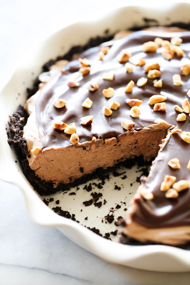 there is a chocolate pie with nuts on top