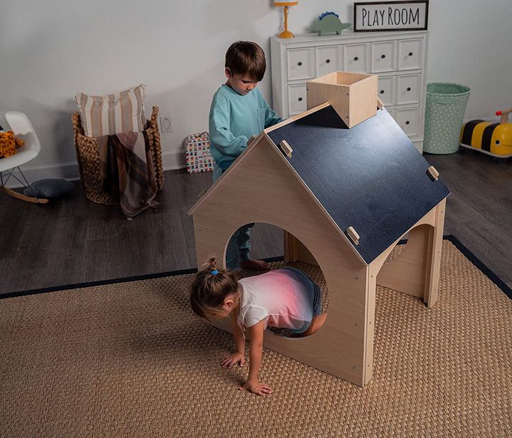 Introducing Avenlur’s Evergreen, a children's playhouse that's not just a playhouse—it's a universe of imagination waiting to unfold. Designed for ages 1-6, this wooden wonder features double chalkboards and a reversible art easel, sparking creativity in every corner. From schoolhouse to ice cream stand, spaceship to fort, the Evergreen transforms with each play session, making it a versatile canvas for your child's wildest adventures.   Indoors or out, the Evergreen offers endless possibilities for imaginative play. Set it up in the backyard for outdoor escapades or in the living room for cozy indoor fun. With a chalkboard for school role-play, an easel for budding artists, and a spacious house for imaginative scenarios, this playhouse invites exploration and creativity at every turn.   C Preschool Playroom, Toddler Playhouse, Childrens Playhouse, Modern Playroom, Ice Cream Stand, Indoor Playhouse, Wooden Playhouse, Art Easel, Childhood Days