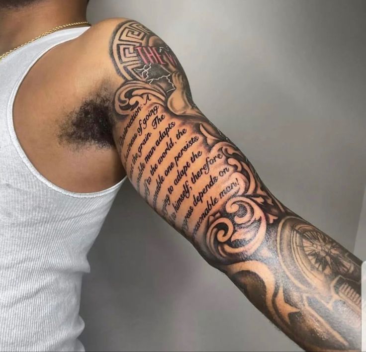 a man with a tattoo on his arm