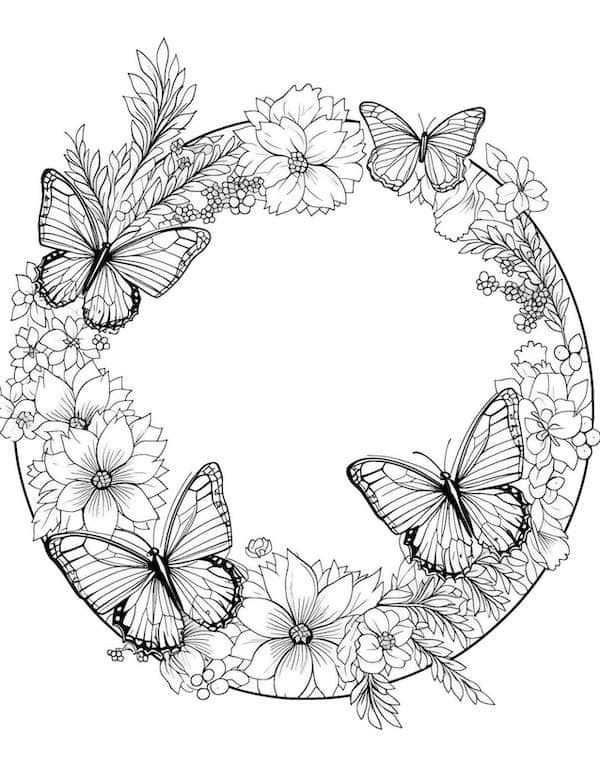 a circular frame with butterflies and flowers