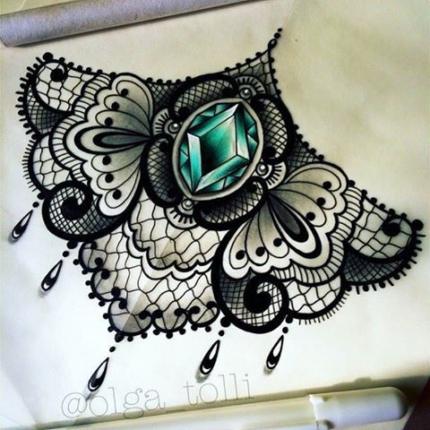 a drawing of an intricate design with a green stone in the center and black lace around it