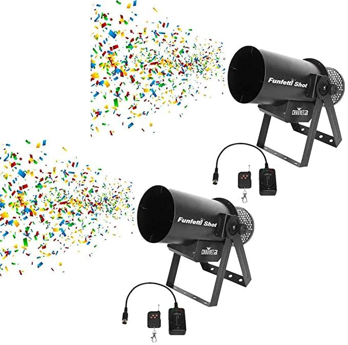 two black speakers sitting next to each other with confetti falling out of them