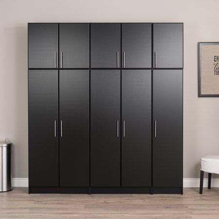 a large black cabinet in the corner of a room