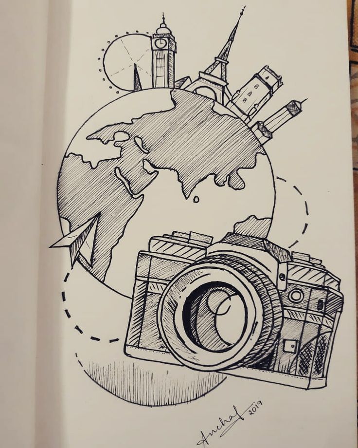 a drawing of a camera on top of a piece of paper with the earth in the background