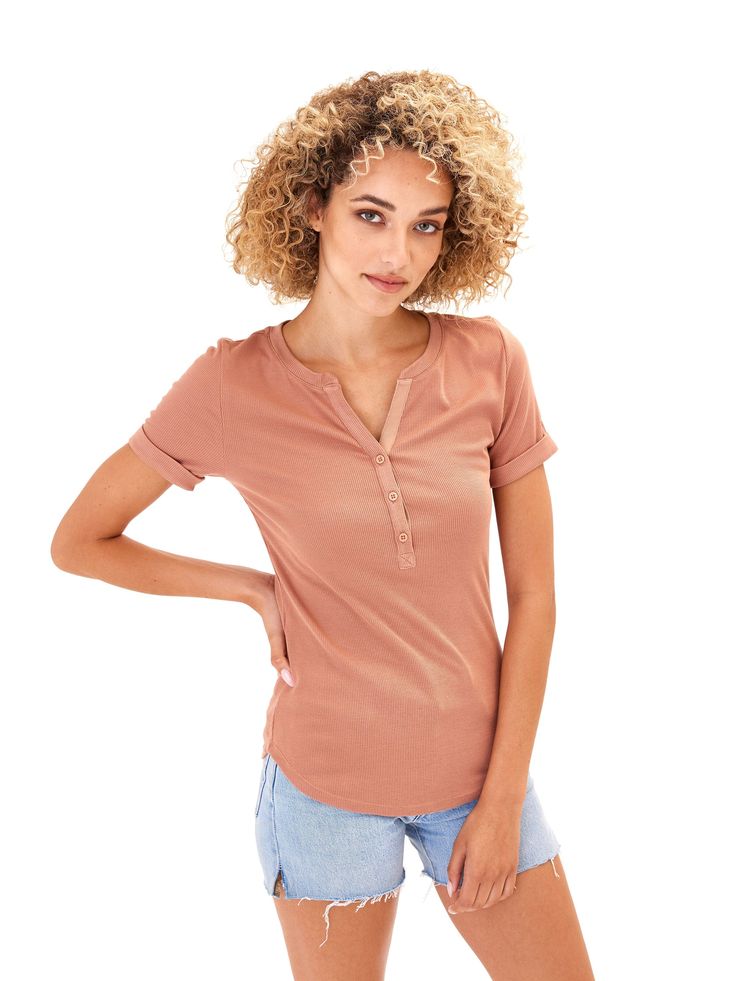 Introducing the Akia Feather Rib Henley Tee - the perfect blend of softness and style. With a ribbed texture and stretchy fabric, it offers a relaxed fit for all-day comfort. Complete with a 3 button detail and cuffed sleeves, this tee is a must-have for any wardrobe. Relaxed Solid Color Tops For Fall, Solid Color Relaxed Tops For Fall, Relaxed Fall Tops, Fitted Henley Neckline Top For Everyday, Comfortable Fitted Tops For Fall, Relaxed Ribbed Top For Fall, Relaxed Ribbed Fall Tops, Relaxed Fit Ribbed Top, Casual Fitted Henley Neckline Top