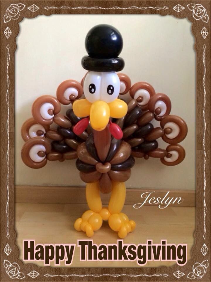 a thanksgiving balloon with a turkey wearing a top hat