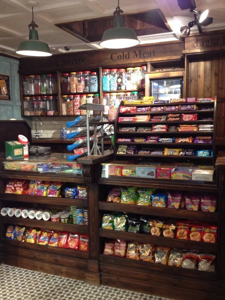 a store filled with lots of different types of food and snacks on display in front of the counter