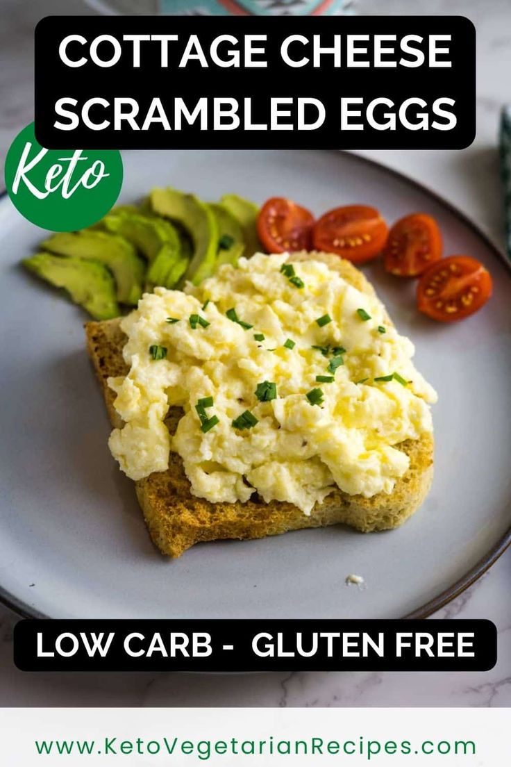 an egg salad on toasted bread with tomatoes and cucumbers in the background