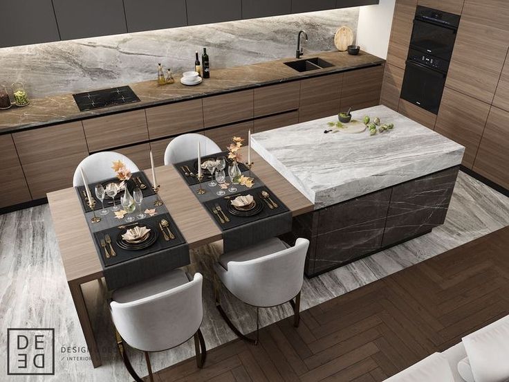 a modern kitchen with marble counter tops and white chairs around the dining room table set for four