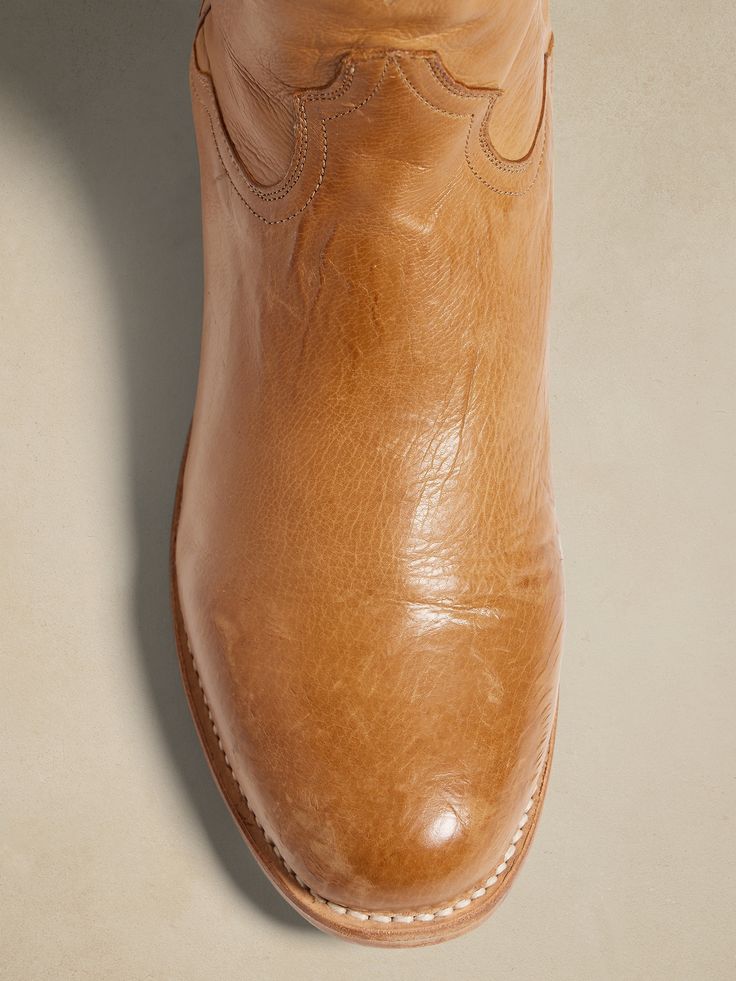 Made to last, the handsomely rugged Stetson Puncher boot is crafted by premium bootmakers using burnished leather with a soft leather lining and removable True X insoles for comfort.  Stetson artisans used 56 lemonwood pegs to withstand the elements Western Boots With Oiled Leather And Leather Sole, Leather Sole Moto Ankle Boots For Ranch, Moto Ankle Boots With Leather Sole For Ranch, Western Oiled Leather Boots With Leather Lining, Leather Sole Ankle Moto Boots For Ranch, Western Calf Leather Boots With Rubber Sole, Leather Boots With Rubber Sole For Ranch, Vegetable-tanned Leather Moc Toe Boots, Plain Toe Boots With Leather Lining For Ranch