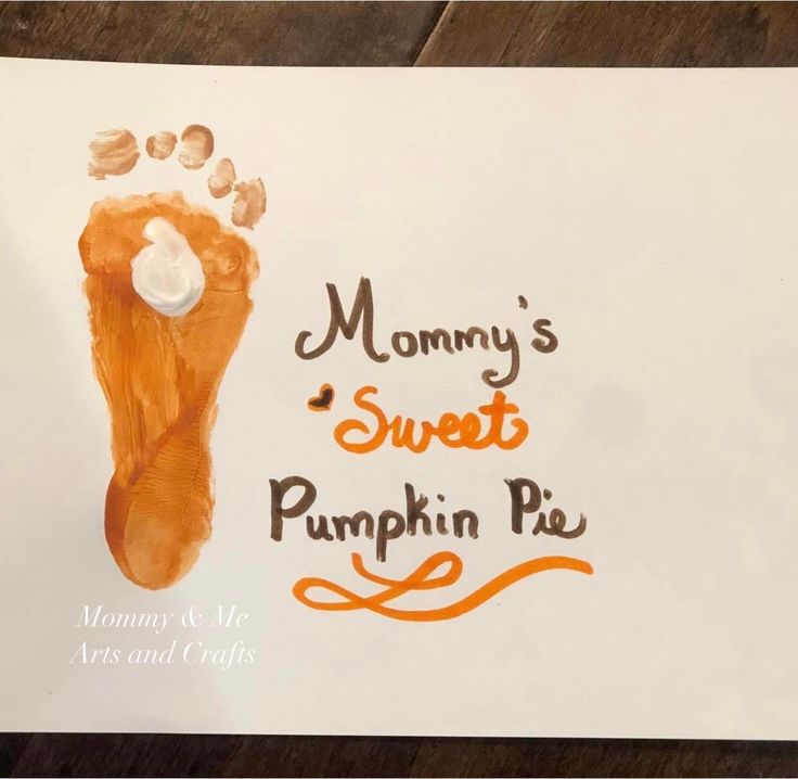 a paper sign that says mommy's sweet pumpkin pie with a handprint on it