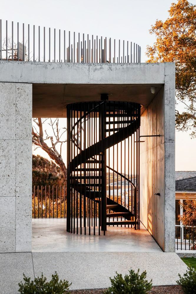 a spiral staircase in the middle of a concrete structure