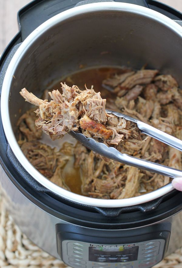 the meat is being cooked in the slow cooker