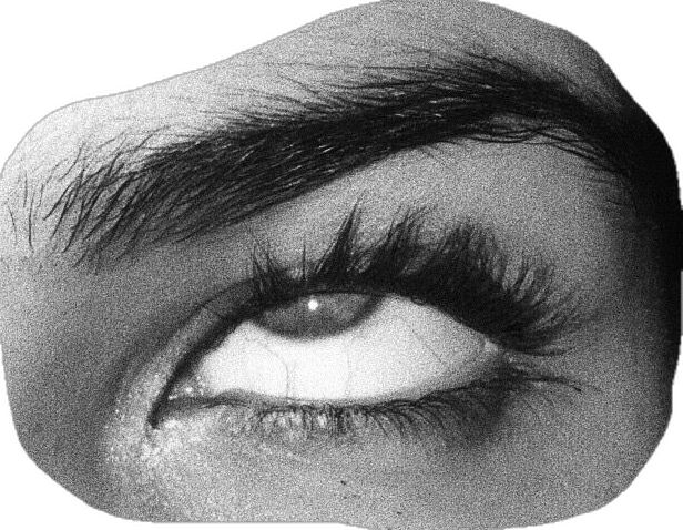 an eye with long lashes is shown in black and white