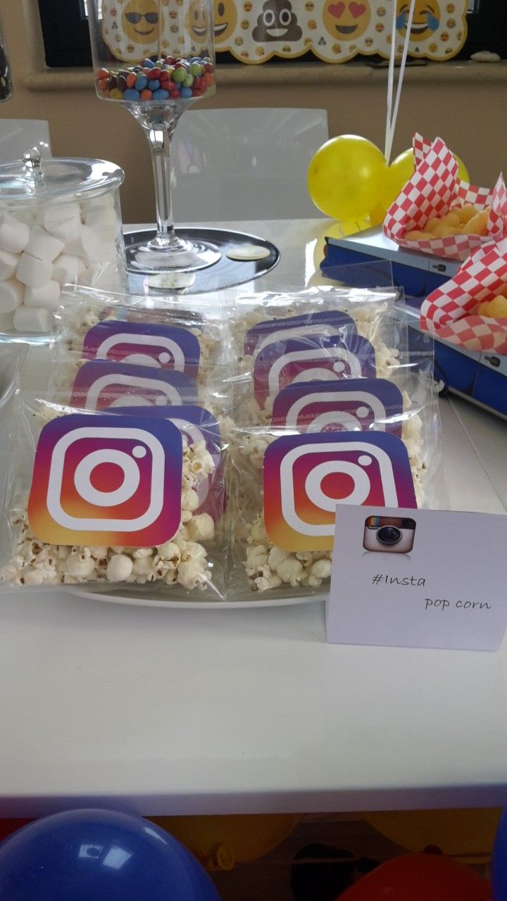 a table topped with lots of food and balloons next to a sign that says instagram