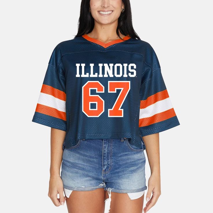 a woman wearing a jersey that says illinois's 69 on the front and an orange, white, and blue stripe across the chest