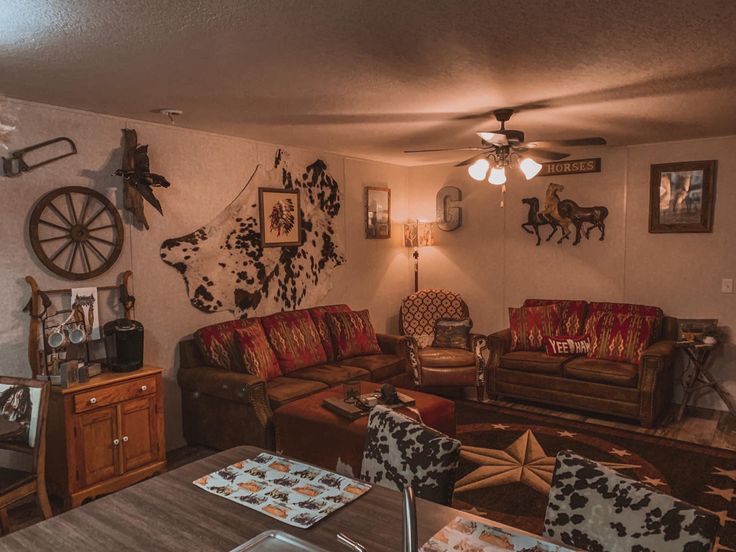 a living room with two couches and a wooden table in front of the wall