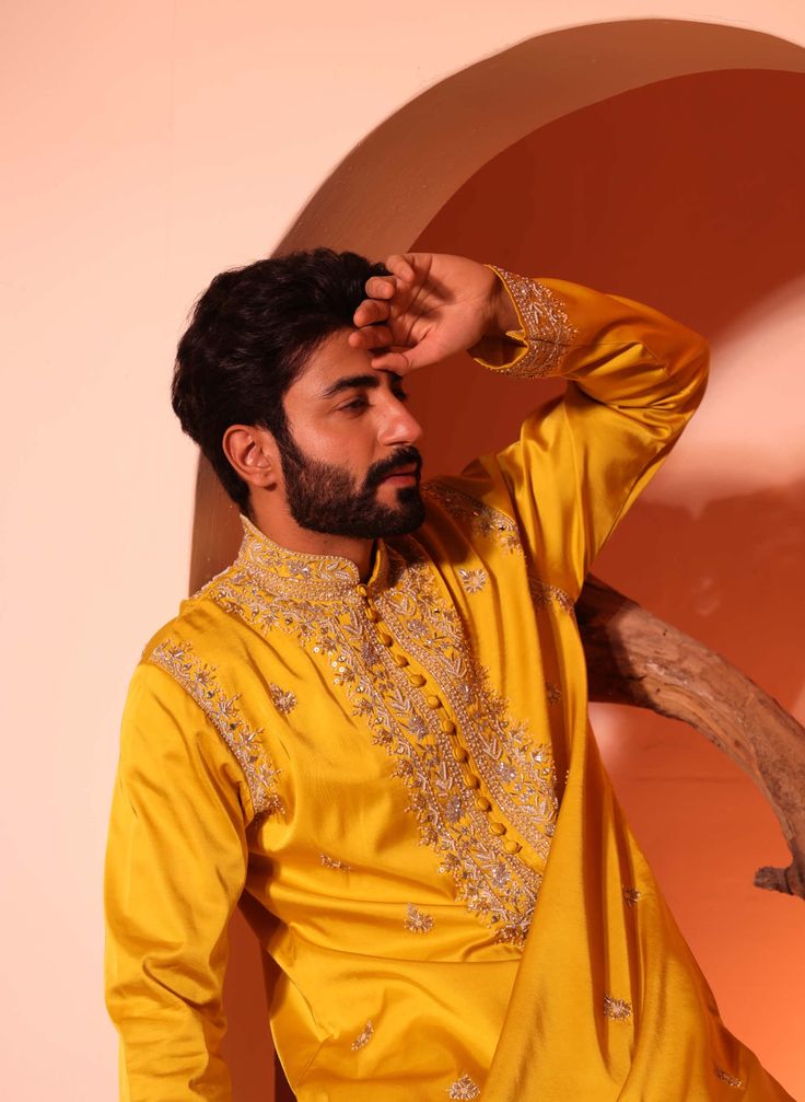 Featuring aain kurta with loop buttons and intricate hand embroidery over yoke, armhole and sleeves with inside lining. Consisting of mirror, bead, thread, sequence work. Chanderi Bandhgala With Mirror Work And Long Sleeves, Long Sleeve Chanderi Bandhgala With Mirror Work, Traditional Kurta With Mirror Work For Diwali, Traditional Draped Kurta With Mirror Work For Diwali, Diwali Traditional Drape Kurta With Mirror Work, Diwali Traditional Kurta With Mirror Work, Eid Chanderi Bandhgala With Mirror Work, Eid Bandhgala With Mirror Work In Chanderi Fabric, Eid Bandhgala With Chanderi Mirror Work