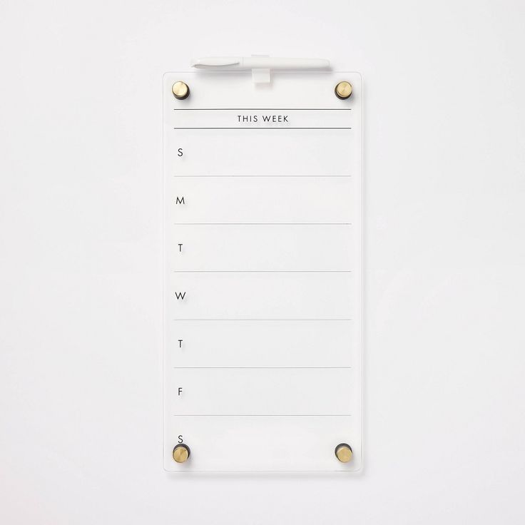 a white clipboard with three pins on it and a notepad attached to the side