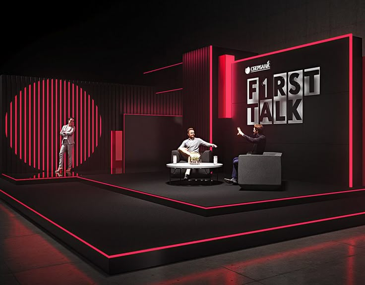 three people sitting on chairs in front of a black and red wall with the words first talk