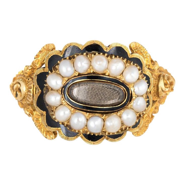 Antique Georgian era memorial ring (circa 1825) crafted in 18 karat yellow gold.   Natural pearls measuring (average) 2.5mm border an oval compartment that holds natural hair. The pearls are in very good condition showing good lustre. The glass case protecting the braided hair is in excellent condition and free of cracks or crisps.       The ring is a wonderful example of Georgian era memorial jewellery with rich floral and scrolled details to the side shoulders. The pearls border a lock of hair Victorian Hair Jewelry, Memory Art, Regency Clothing, Victorian Hair, Lock Of Hair, John Wilson, Sculpture Inspiration, Georgian Jewelry, Memorial Ring