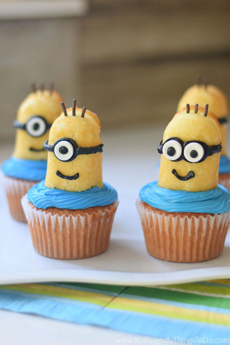 minion cupcakes with blue frosting and eyes on them are ready to be eaten