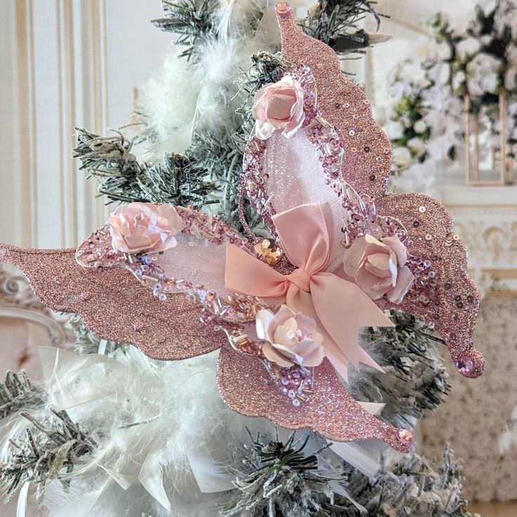 a christmas tree decorated with pink and white ornaments